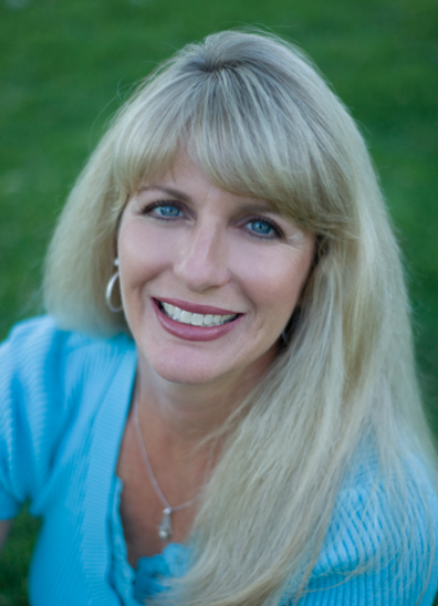 Realtor Carol Lipstreu-Wagner smiling in portrait for Lyon Real Estate.