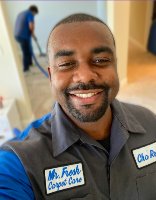 Owner Cha'ron Russell from Mr. Fresh Carpet Care smiling at Fairfield CA office.
