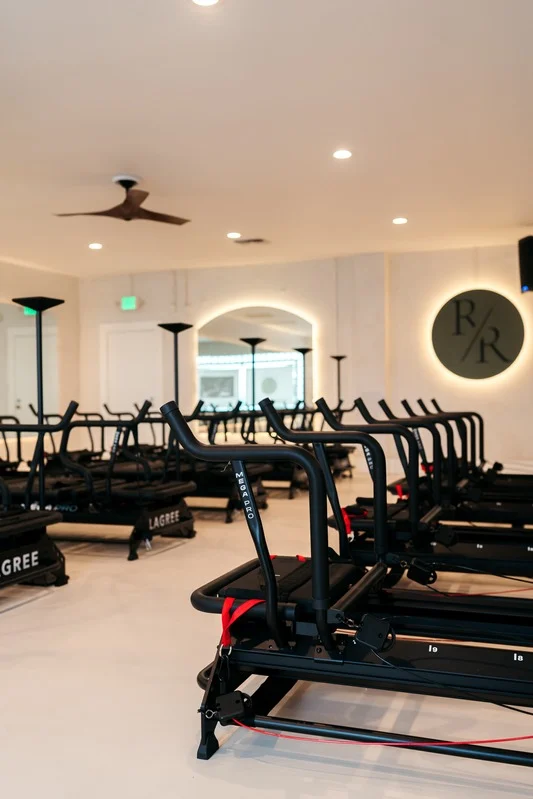 Interior of Reform Room Lagree fitness studio in Fairfield CA with exercise equipment.