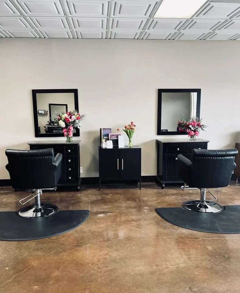 Modern salon interior with styling chairs at Salon Collective GV in Fairfield CA.